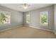 This neutral bedroom features plantation shutters and a ceiling fan at 5405 Merritt Island Dr, Apollo Beach, FL 33572