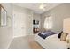Comfortable bedroom featuring a plush bed, ceiling fan, and a view of a wall-mounted TV at 5405 Merritt Island Dr, Apollo Beach, FL 33572