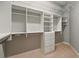 Walk-in closet with custom shelving, drawers, and ample storage space at 5405 Merritt Island Dr, Apollo Beach, FL 33572