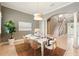 Beautiful dining room with a white table set for a meal, complemented by stylish decor at 5405 Merritt Island Dr, Apollo Beach, FL 33572