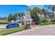 Community entrance features a gate, fountain, and lush landscaping at 5405 Merritt Island Dr, Apollo Beach, FL 33572