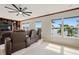Home theater features comfortable seating, built-in shelving, and water views at 5405 Merritt Island Dr, Apollo Beach, FL 33572