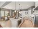 Open-concept kitchen featuring an island and stainless appliances, with a dining area at 5405 Merritt Island Dr, Apollo Beach, FL 33572