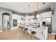 Open kitchen featuring a large island with seating and stainless steel appliances at 5405 Merritt Island Dr, Apollo Beach, FL 33572