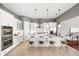Bright and modern kitchen with stainless steel appliances and a large center island at 5405 Merritt Island Dr, Apollo Beach, FL 33572