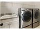 Laundry room has a utility sink and full-size washer and dryer at 5405 Merritt Island Dr, Apollo Beach, FL 33572