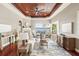 Bright and airy living room featuring hardwood floors, a fireplace, and serene water views at 5405 Merritt Island Dr, Apollo Beach, FL 33572