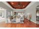 Open-concept living room offering beautiful wood floors and views of the kitchen at 5405 Merritt Island Dr, Apollo Beach, FL 33572