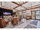 The clubhouse lounge features wood beams, chandeliers, and ample seating at 5405 Merritt Island Dr, Apollo Beach, FL 33572