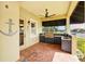 Outdoor kitchen equipped with a built-in grill, sink, and ample counter space for al fresco dining and entertaining at 5405 Merritt Island Dr, Apollo Beach, FL 33572