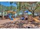 Community playground with slides and climbing structures under the shade of mature trees by the water at 5405 Merritt Island Dr, Apollo Beach, FL 33572