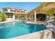Inviting backyard pool and patio area with seamless indoor/outdoor living through large sliding glass doors at 5405 Merritt Island Dr, Apollo Beach, FL 33572
