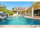 Stunning pool area featuring a rock waterfall and lush tropical landscaping creates a private outdoor oasis at 5405 Merritt Island Dr, Apollo Beach, FL 33572