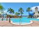 Resort-style pool with waterslide, splash pad, and lounge areas, perfect for relaxation and recreation at 5405 Merritt Island Dr, Apollo Beach, FL 33572