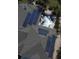 Aerial view of solar panels on the roof of the home next to a luxurious pool with rock features at 5405 Merritt Island Dr, Apollo Beach, FL 33572