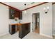 Custom wet bar with wine storage, sink, and cabinetry in home at 5405 Merritt Island Dr, Apollo Beach, FL 33572