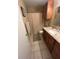 Bathroom featuring granite countertops and cherry wood cabinets at 8653 Fancy Finch Dr # 102, Tampa, FL 33614