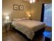 Cozy bedroom with wood floors, ceiling fan, and natural light from the window at 8653 Fancy Finch Dr # 102, Tampa, FL 33614