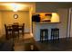 Dining area open to kitchen with tile flooring and seating for four at 8653 Fancy Finch Dr # 102, Tampa, FL 33614