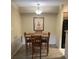 Dining area with seating for four and pendant lighting at 8653 Fancy Finch Dr # 102, Tampa, FL 33614