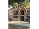 Two story brick apartment building with mature tree at 8653 Fancy Finch Dr # 102, Tampa, FL 33614