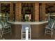 Picturesque gazebo with brick columns, tile countertop and casual seating overlooking the community at 8653 Fancy Finch Dr # 102, Tampa, FL 33614