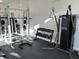 Community gym with weightlifting machine and dumbbell rack for comprehensive workout options at 8653 Fancy Finch Dr # 102, Tampa, FL 33614