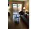 Cozy living room with a sliding glass door and tile flooring at 8653 Fancy Finch Dr # 102, Tampa, FL 33614