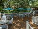 Inviting outdoor lounge area with shaded seating and well-maintained wooden deck for residents at 8653 Fancy Finch Dr # 102, Tampa, FL 33614