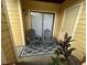 Relaxing outdoor patio with two chairs, a patterned rug, and a private entrance at 8653 Fancy Finch Dr # 102, Tampa, FL 33614