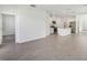 Bright, open-concept living area and kitchen with a spacious design and modern appliances at 1869 Brekey Way, Zephyrhills, FL 33541