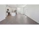 Open-concept living room with hardwood floors, lots of natural light and an eat-in kitchen at 1869 Brekey Way, Zephyrhills, FL 33541