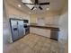 Modern kitchen with stainless steel appliances, ample counter space, and white cabinetry at 89 Mark Twain Ln, Rotonda West, FL 33947