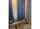 Cozy bathroom featuring a shower with blue curtains, white tile, and a standard toilet at 18660 White Pine Cir, Hudson, FL 34667