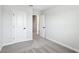 Comfortable bedroom with neutral walls and carpet, complemented by white trim and doors at 7270 Deer Valley Cir, Tampa, FL 33635