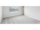 Bedroom featuring large windows and neutral carpet at 7270 Deer Valley Cir, Tampa, FL 33635