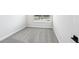 Inviting bedroom with soft gray carpet and a window overlooking a serene outdoor view at 7270 Deer Valley Cir, Tampa, FL 33635