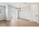 Empty dining area with wood-look tile flooring and a sliding glass door at 7270 Deer Valley Cir, Tampa, FL 33635