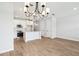 Open-concept living area with wood-look tile flooring and a view of the kitchen at 7270 Deer Valley Cir, Tampa, FL 33635