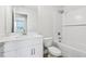 This bathroom has a white sink, white toilet, and a shower/tub combo at 7272 Deer Valley Circle, Tampa, FL 33635