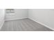 Empty bedroom showcasing neutral walls, plush carpet, and a bright window, ready for your personal touch at 7272 Deer Valley Circle, Tampa, FL 33635