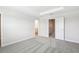 Spacious bedroom with plush carpet, tray ceiling, and access to adjacent rooms and en-suite bathroom at 7272 Deer Valley Circle, Tampa, FL 33635