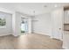 Open dining area with tile floors, a patio door, and a modern chandelier at 7272 Deer Valley Circle, Tampa, FL 33635
