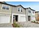 Attractive townhomes with paver driveway, one car garage, and manicured landscaping at 7272 Deer Valley Circle, Tampa, FL 33635