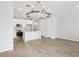 Modern kitchen and dining area with pendant lighting, stainless appliances, and tile floors at 7272 Deer Valley Circle, Tampa, FL 33635