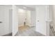 A dedicated laundry space with storage shelves, washer/dryer hookups, and easy access to other areas of the home at 7272 Deer Valley Circle, Tampa, FL 33635