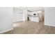 Open living space with tile floors, modern lighting, and a view of the kitchen at 7272 Deer Valley Circle, Tampa, FL 33635