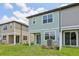 Exterior view of two-story homes with green lawns at 7274 Deer Valley Cir, Tampa, FL 33635
