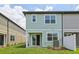 Exterior view of a two-story light blue home with white trim at 7274 Deer Valley Cir, Tampa, FL 33635