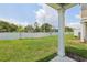 Beautiful backyard featuring green grass and a white vinyl fence at 7274 Deer Valley Cir, Tampa, FL 33635